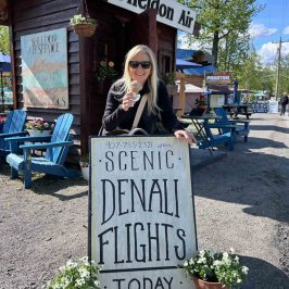 Denali Scenic Flight Photo Op in front of the Sheldon Kiosk