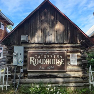 Wooden building labeled 'Talkeetna Roadhouse Est. 1944'
