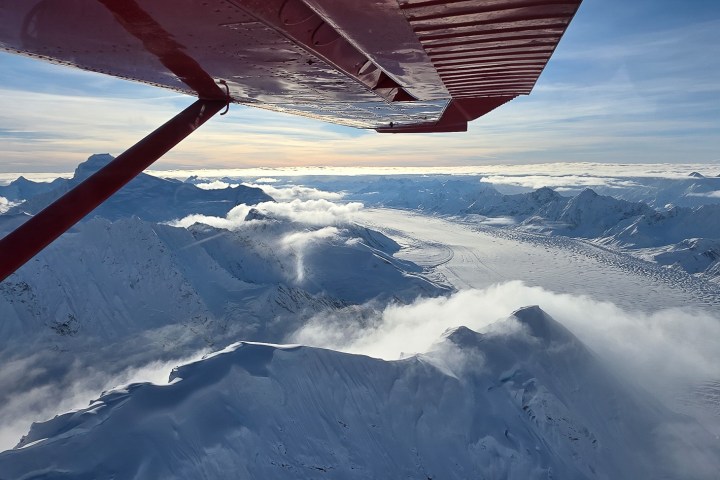 Flightseeing Denali during Winter above clouds