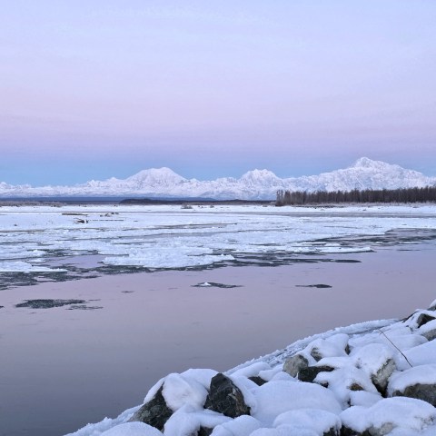 The view of Denali Hunter and Foraker from the Susitna River during freeze up in Talkeetna on Sunrise