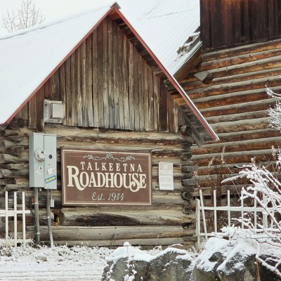 Historic Talkeetna Roadhouse building in Talkeetna during first snow 2025