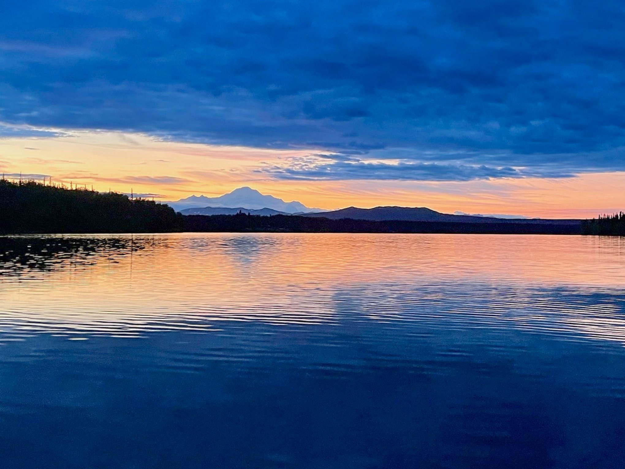 Private Flights to Lake Swimming on sunset in Alaska
